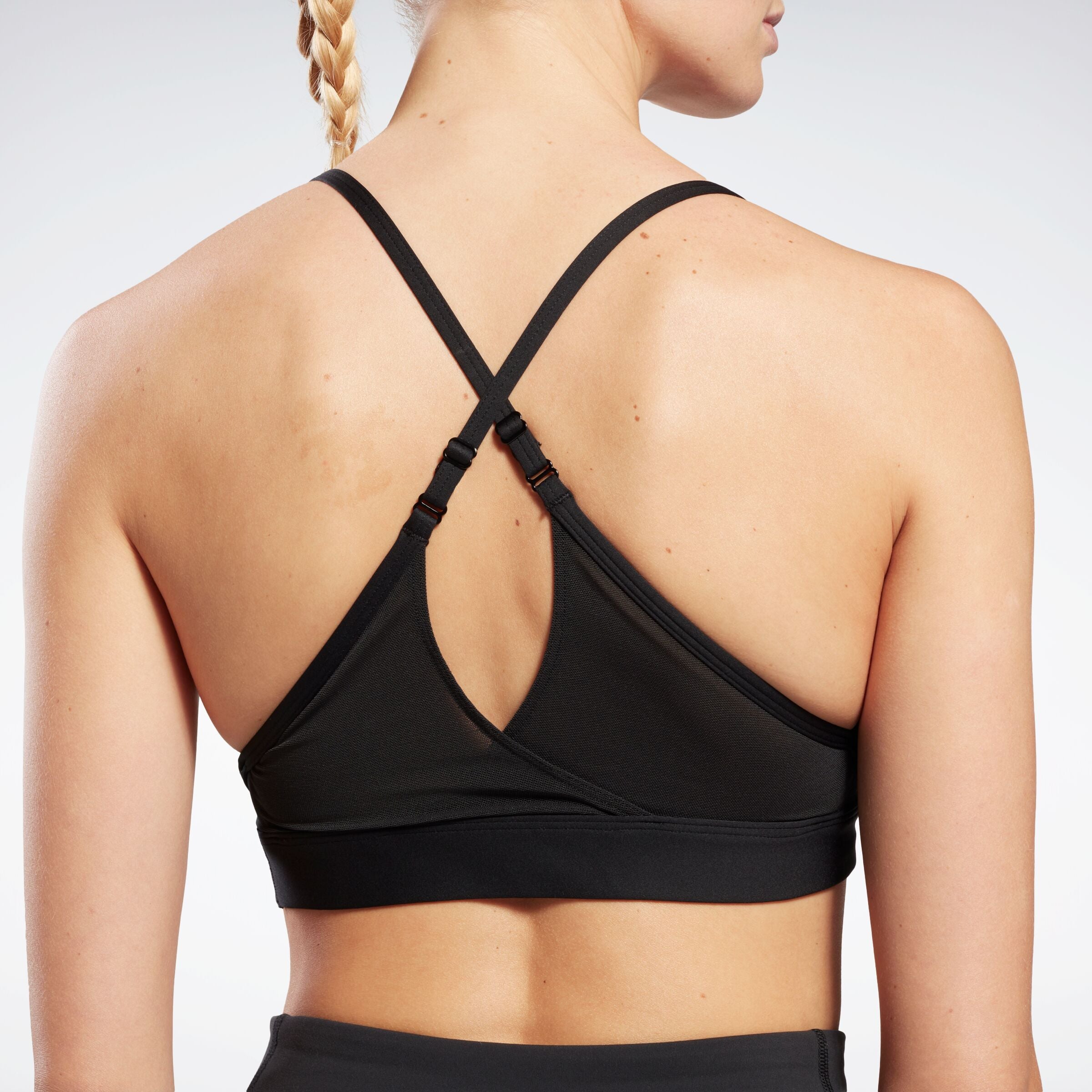 Reebok Women's Reebok Lux Strappy Sports Bra  In Black REG