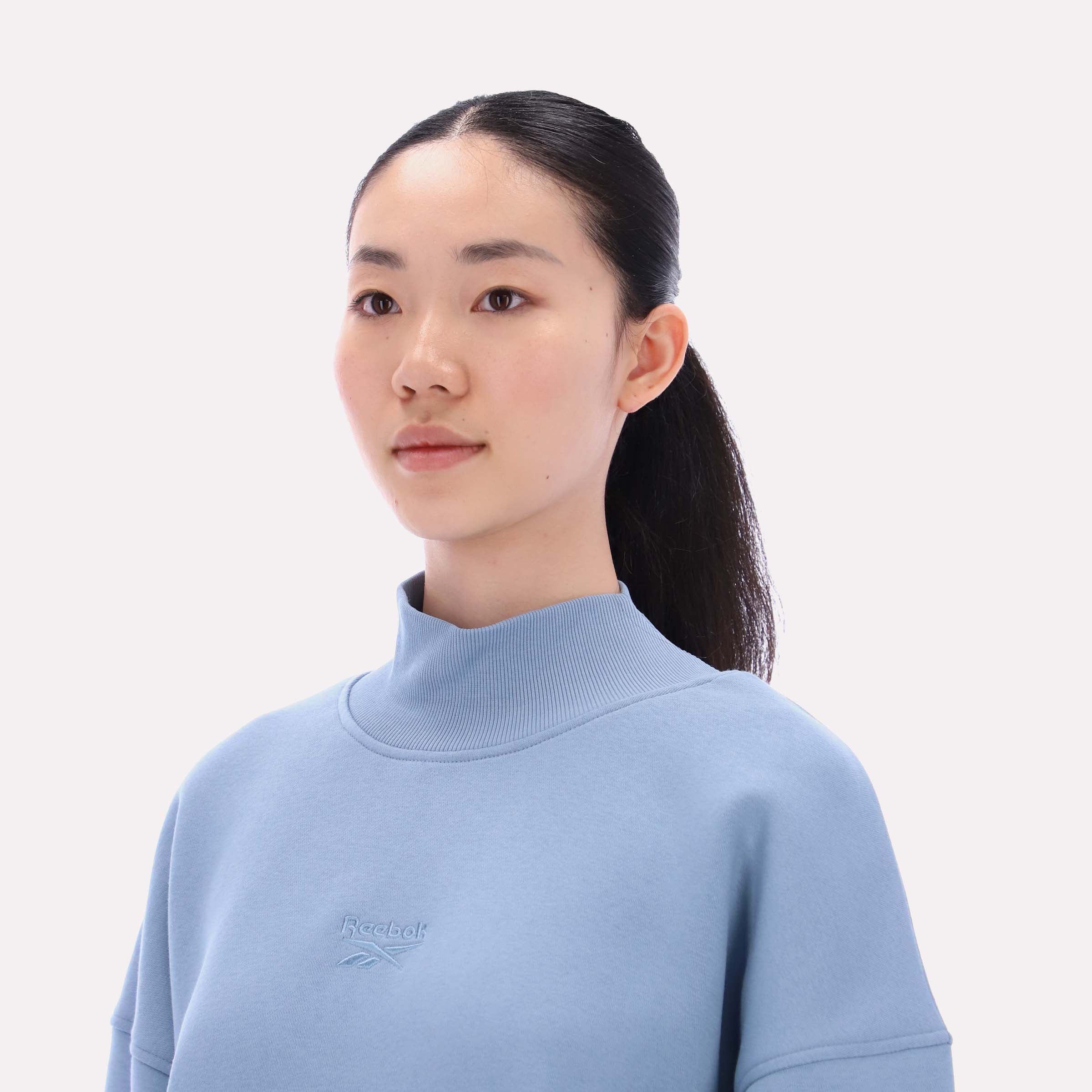 Reebok Women's Harper Longline Roll Neck Sweatshirt  In Leisure Blue REG