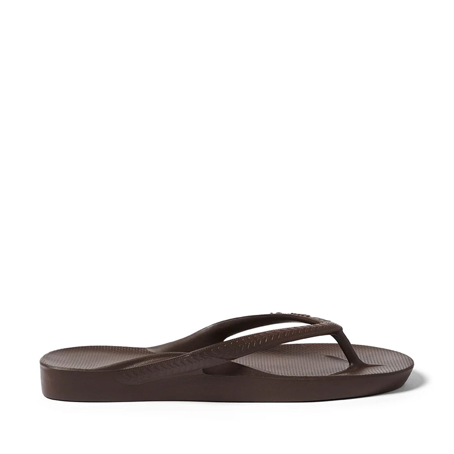 Brown thong flip flops on a Brown background