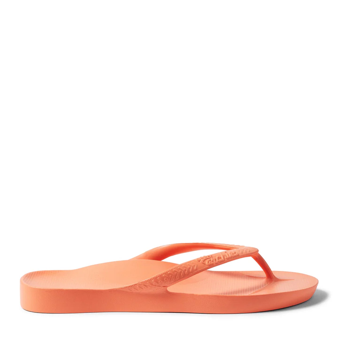 Peach thong flip flops on a Peach background