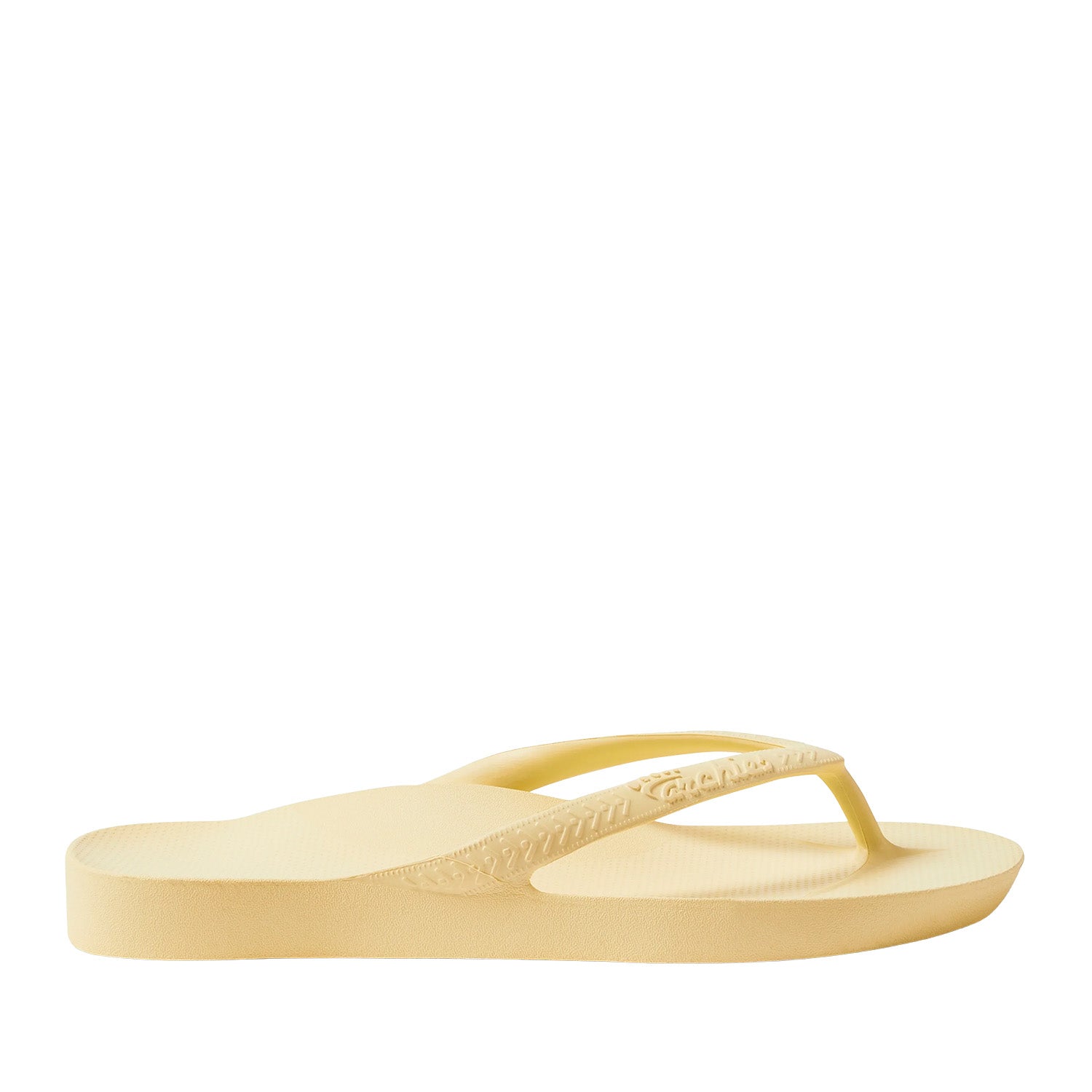 Yellow thong flip flops on a black background