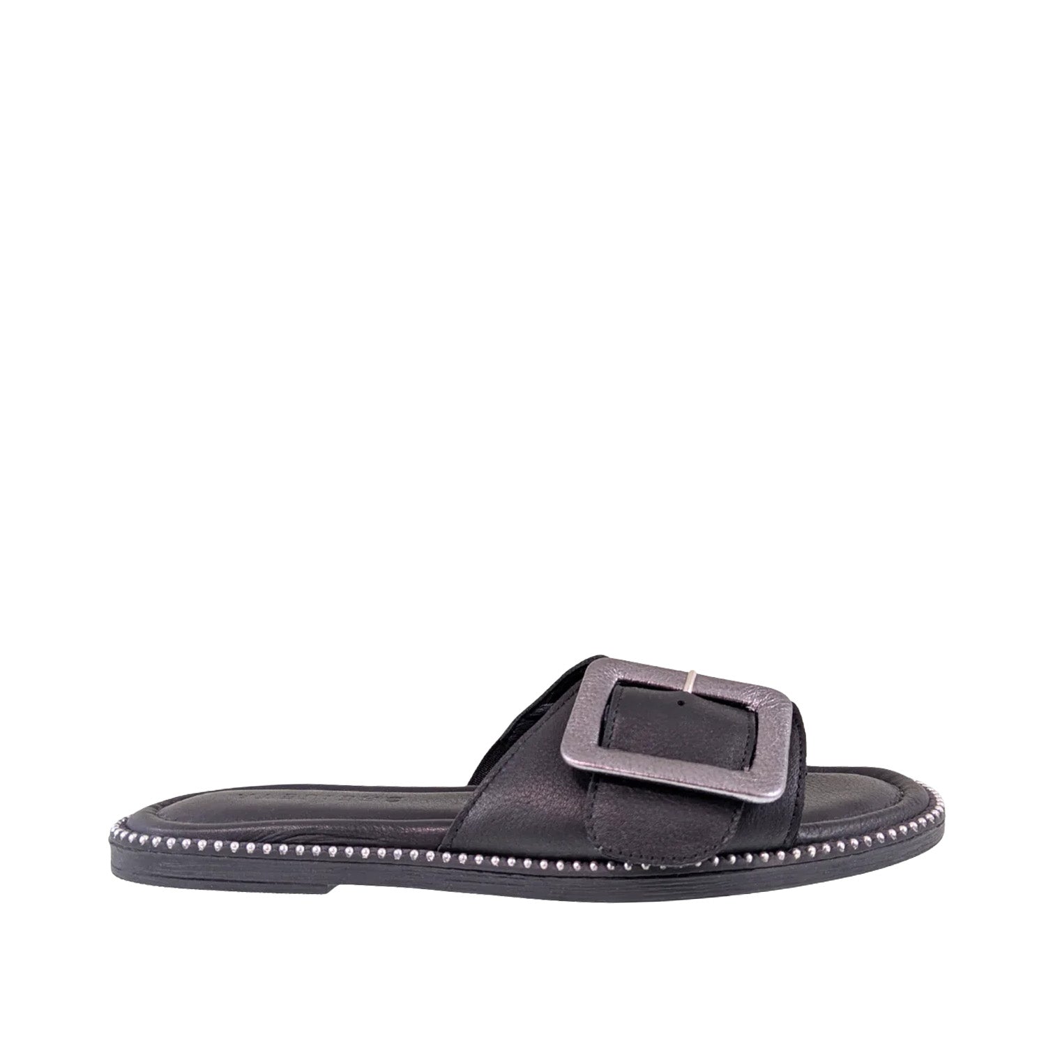 Black leather slip-on sandal with oversized buckle detail on a white background.