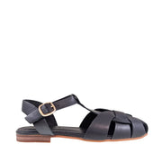 Black sandal with a gold buckle on a white background