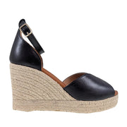 Black leather espadrille wedge sandal with ankle strap. 