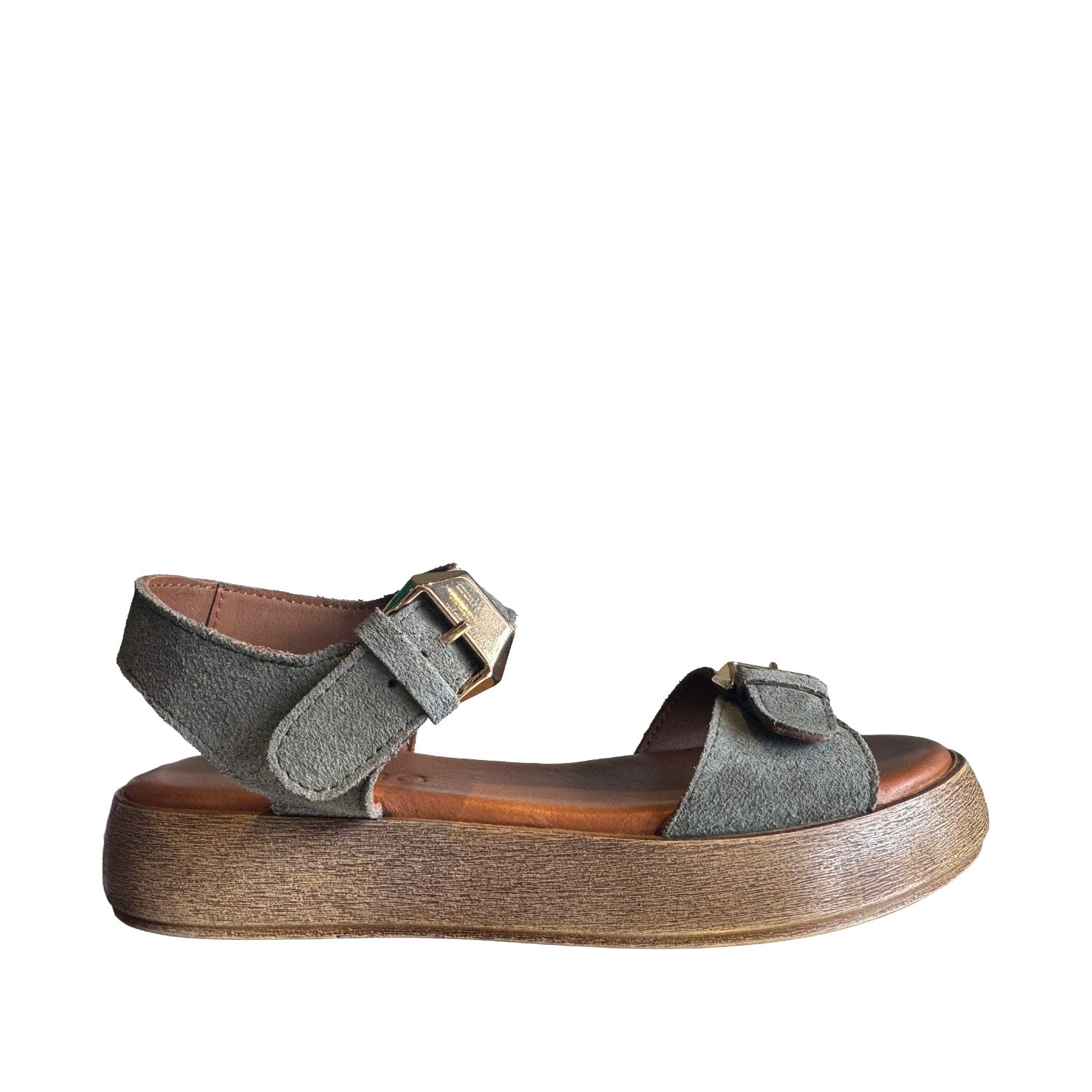 Green suede sandal with adjustable buckle straps at the ankle and toe, on a white background.