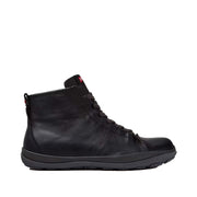 black leather laced ankle boots on a white background