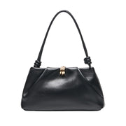 black leather shoulder bag on a white background