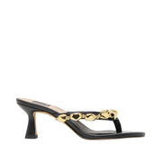 Black kitten heel sandal with gold detail along op on white background