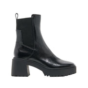 black platform heeled leather ankle boot on a white background