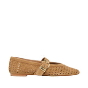 Tan flat shoe with a gold buckle on a white background