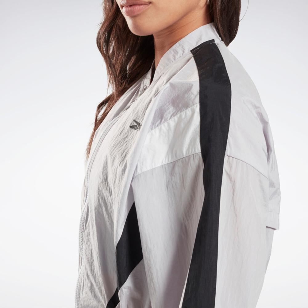 Veste tissée Reebok pour femme, gris standard. Application d'entraînement Reebok pour femme.