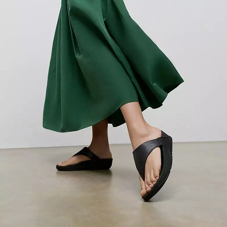 Black platform toe-post flip flop sandal. 