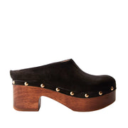 black leather studded platform wooden clog mule on a white background
