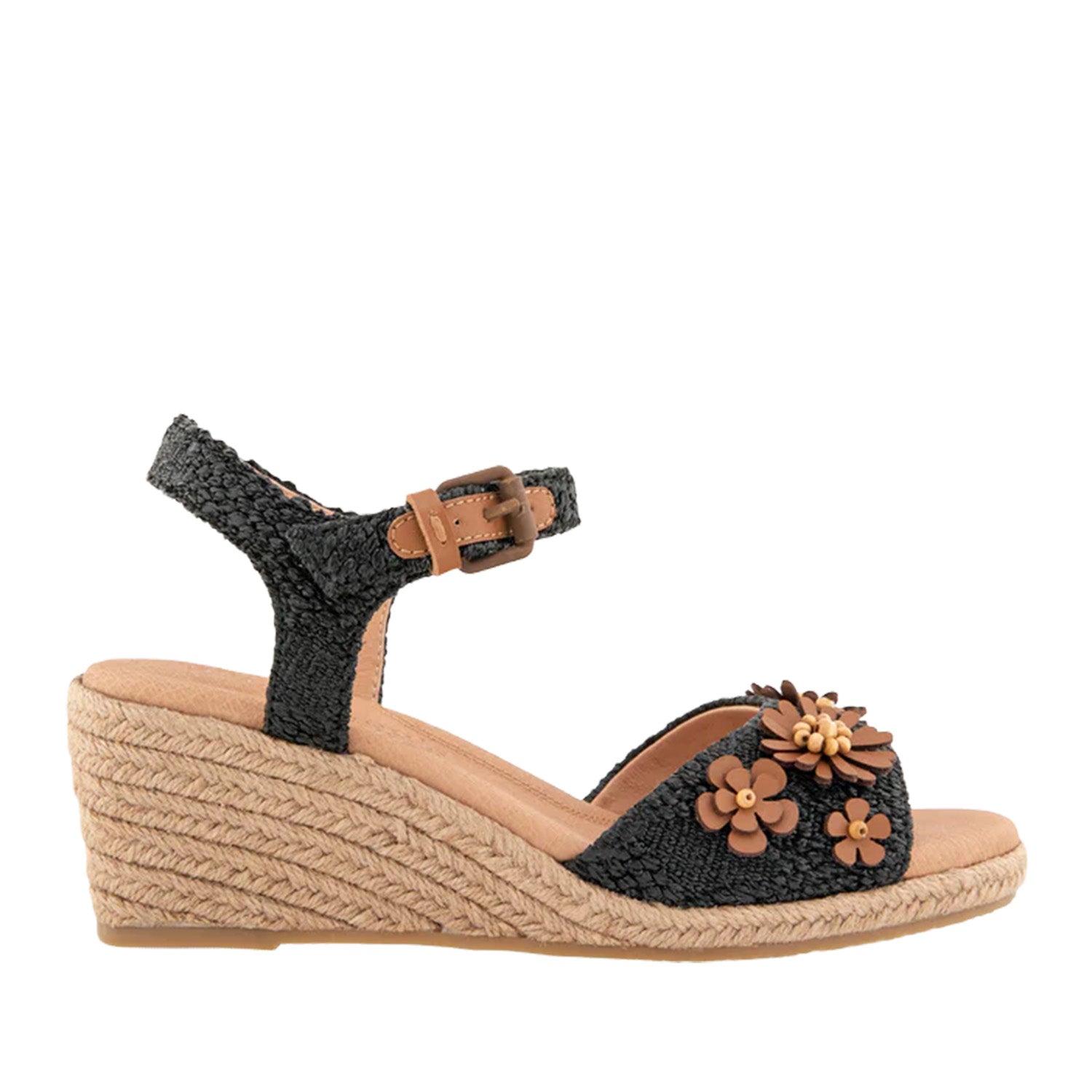 Black raffia espadrille wedge sandal with ankle strap buckle, and 3D flower embellishments on toe strap. 
