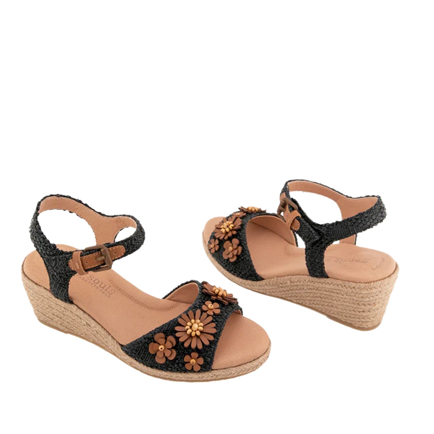 Black raffia espadrille wedge sandal with ankle strap buckle, and 3D flower embellishments on toe strap. 