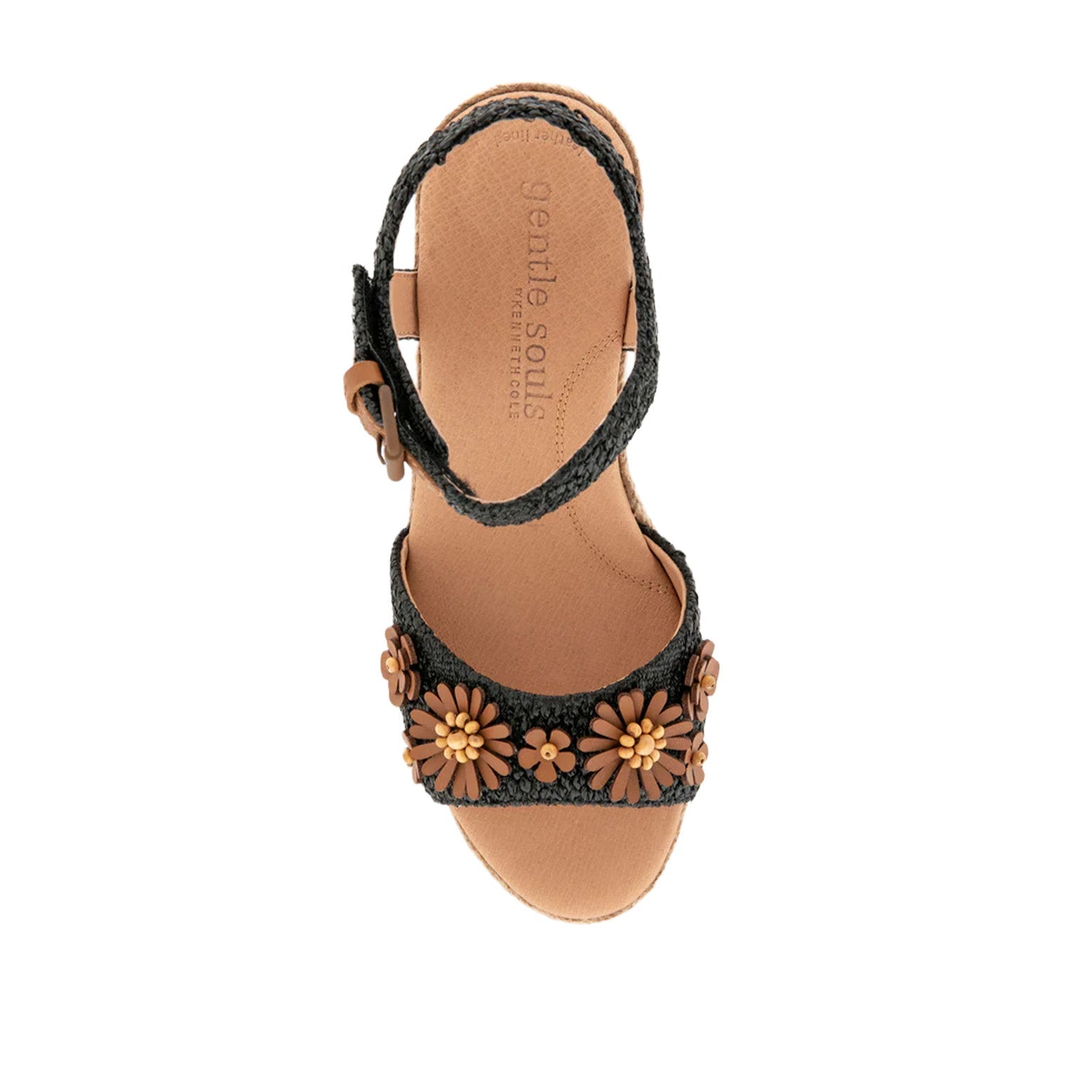 Black raffia espadrille wedge sandal with ankle strap buckle, and 3D flower embellishments on toe strap. 