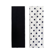 solid black headband and white headband with black polka dots on a white background
