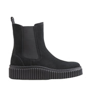black suede chelsea boot on a white background