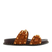 Orange brown slip-on slide sandal with double straps, gold buckles, and round embellishment studs. 