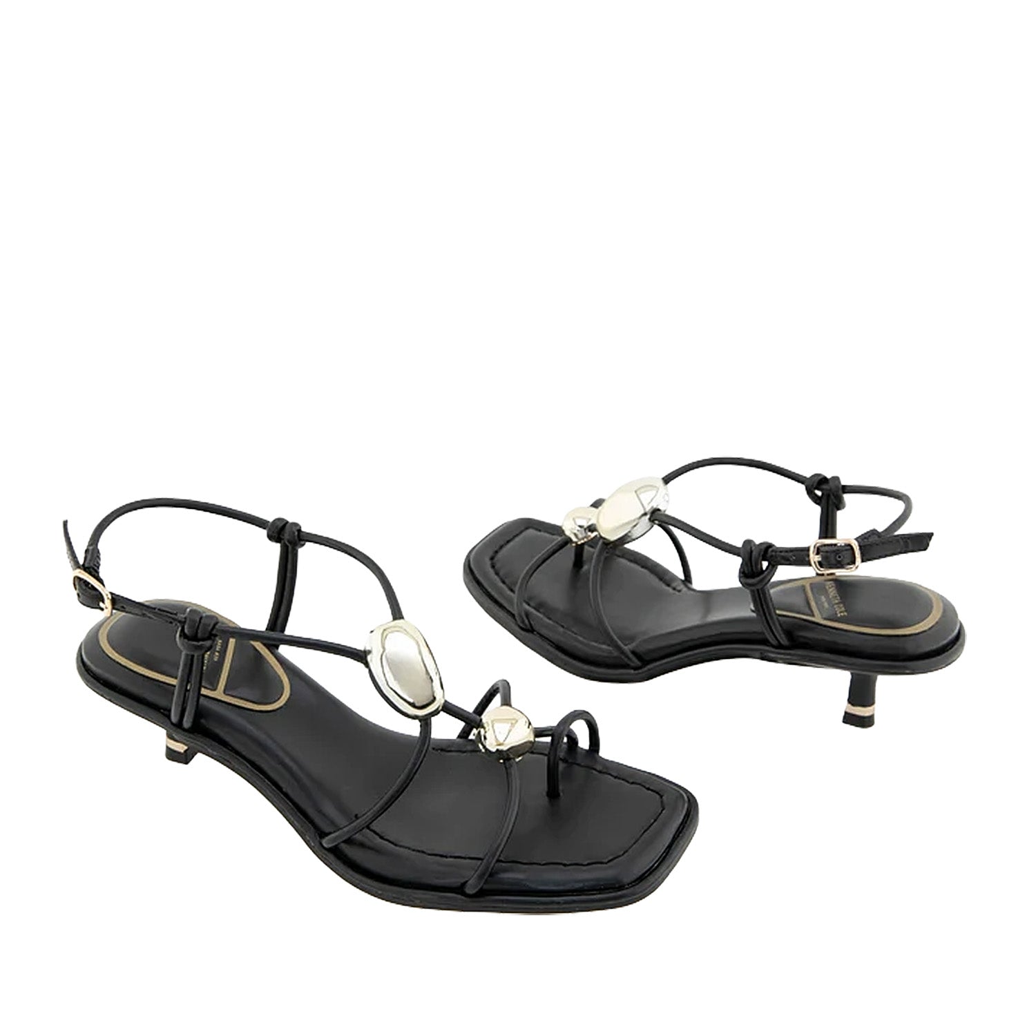 Black strappy sandal with decorative hardware, a toe-ring, and kitten heel.