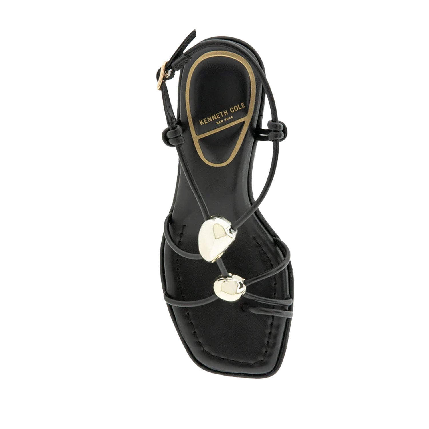 Black strappy sandal with decorative hardware, a toe-ring, and kitten heel.