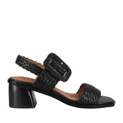 Black woven leather sandal with oversized adjustable buckle and block heel.