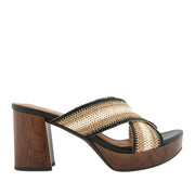 Brown and black platform clog sandal with a crisscross woven striped strap. 