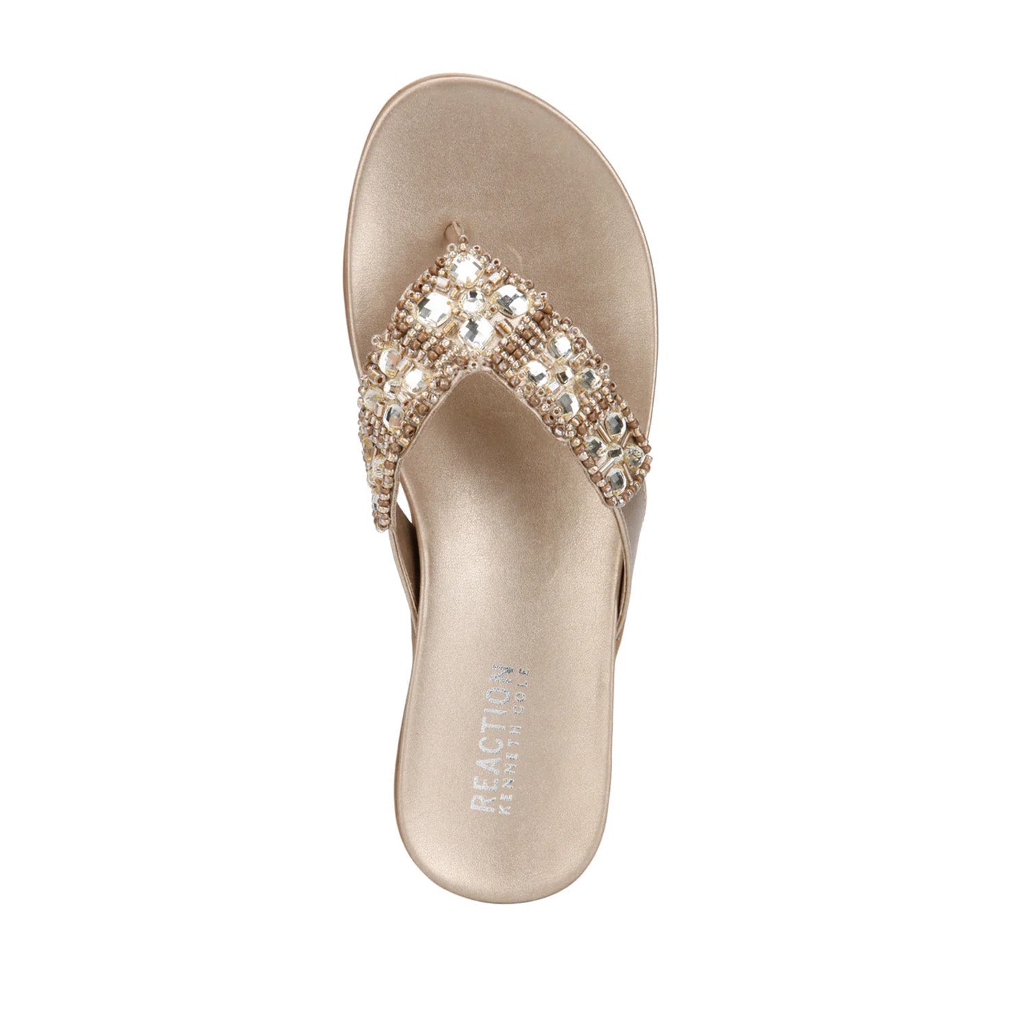 Champagne flip-flop with embellished rhinestone straps. 