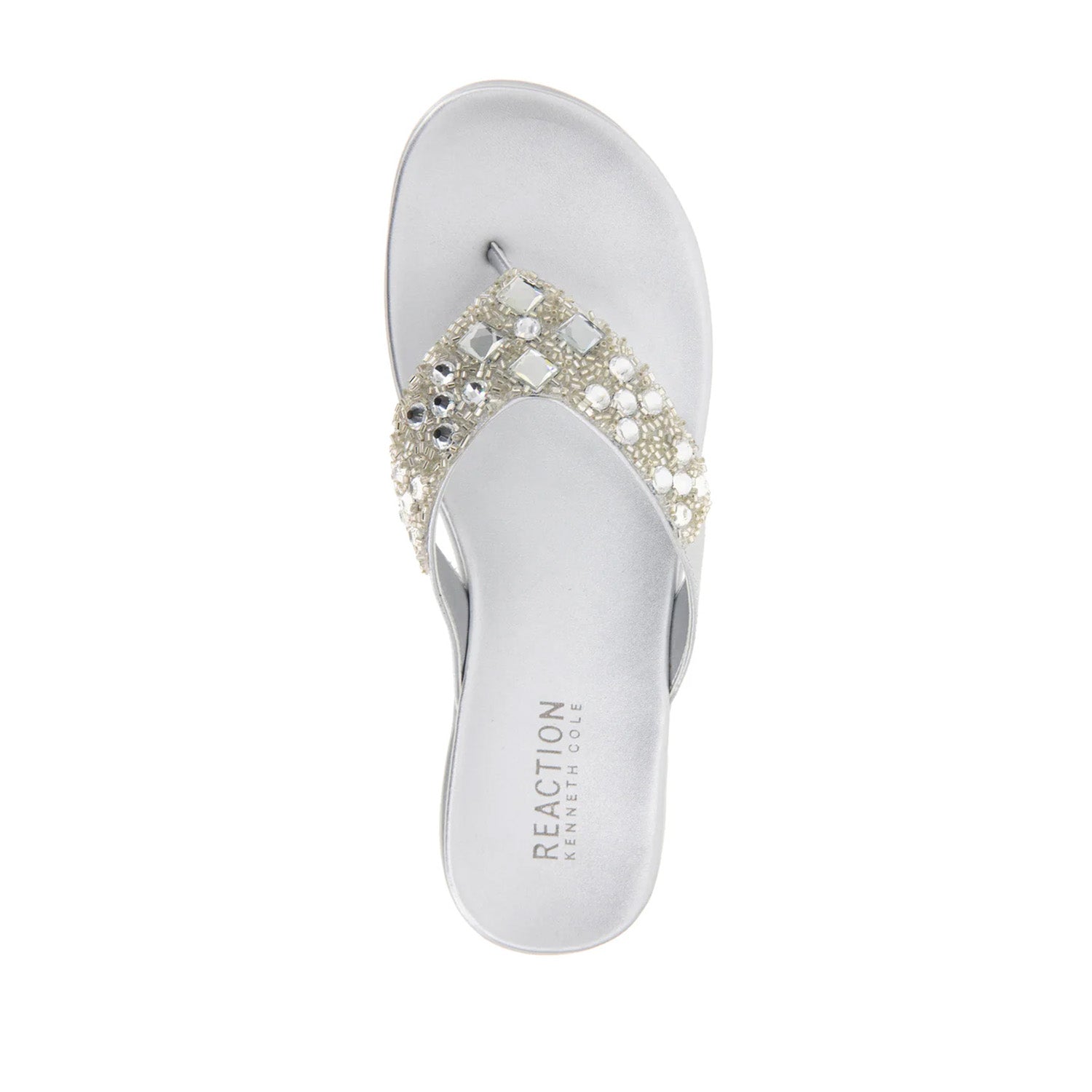 Silver flip-flop with embellished rhinestone straps. 