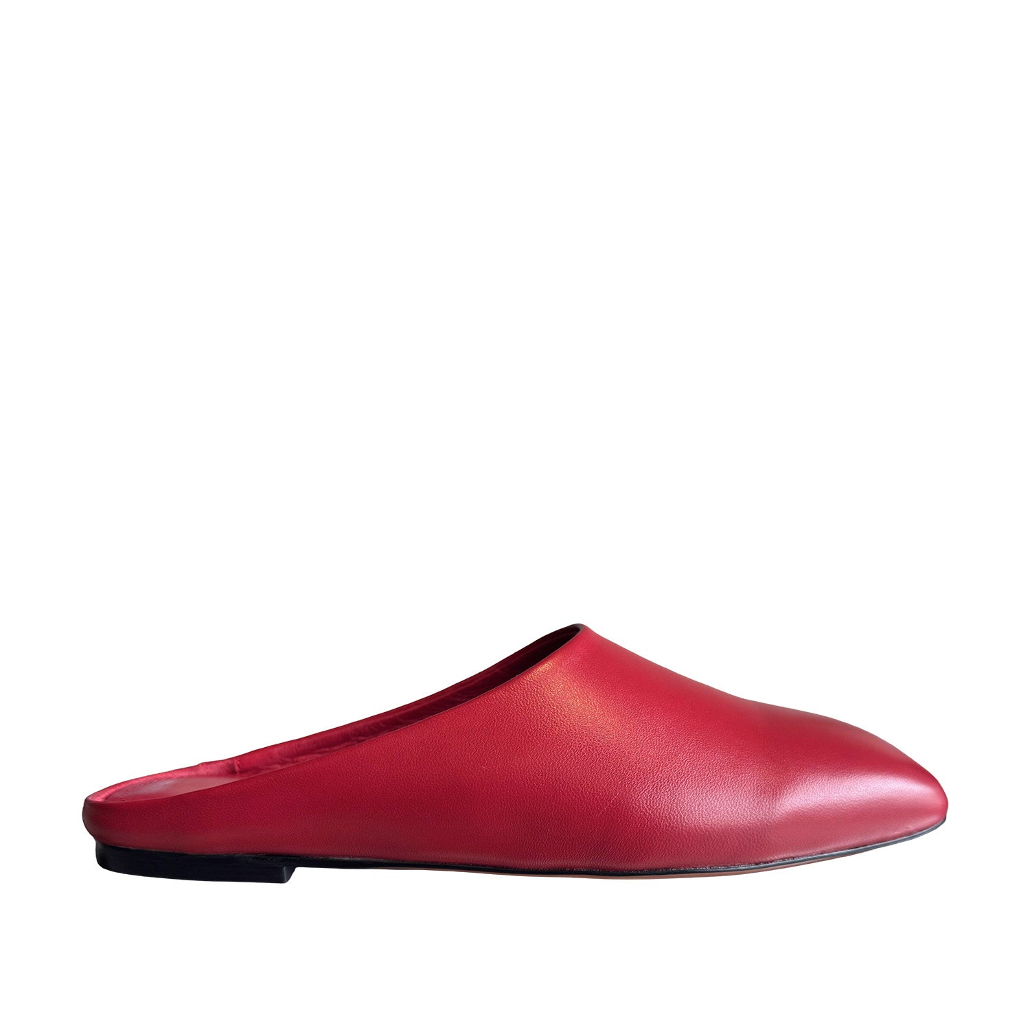 Red slip-on mule shoe on a white background.