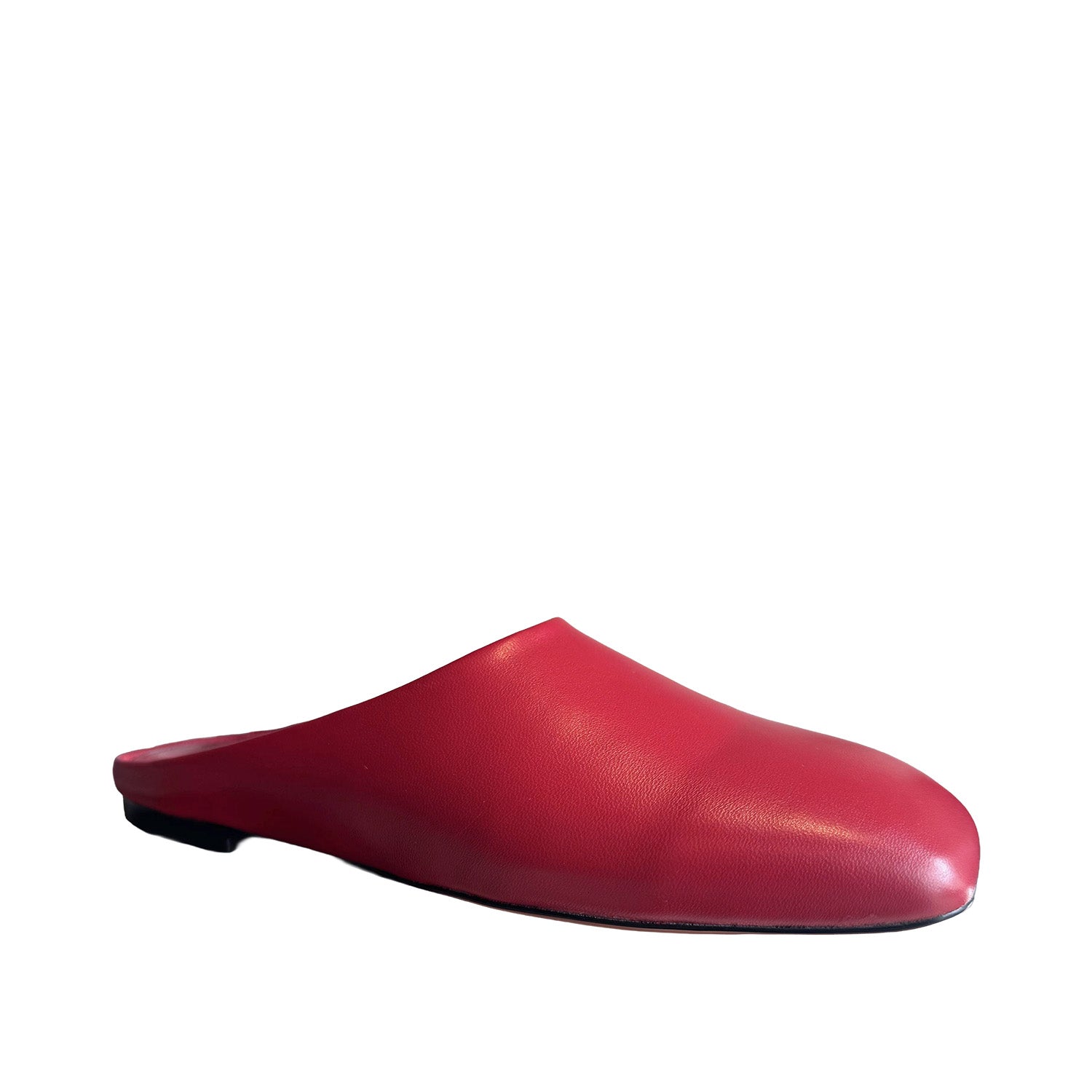 Red slip-on mule shoe on a white background.