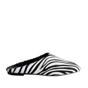 Black and white patterned slip on shoe on a white background