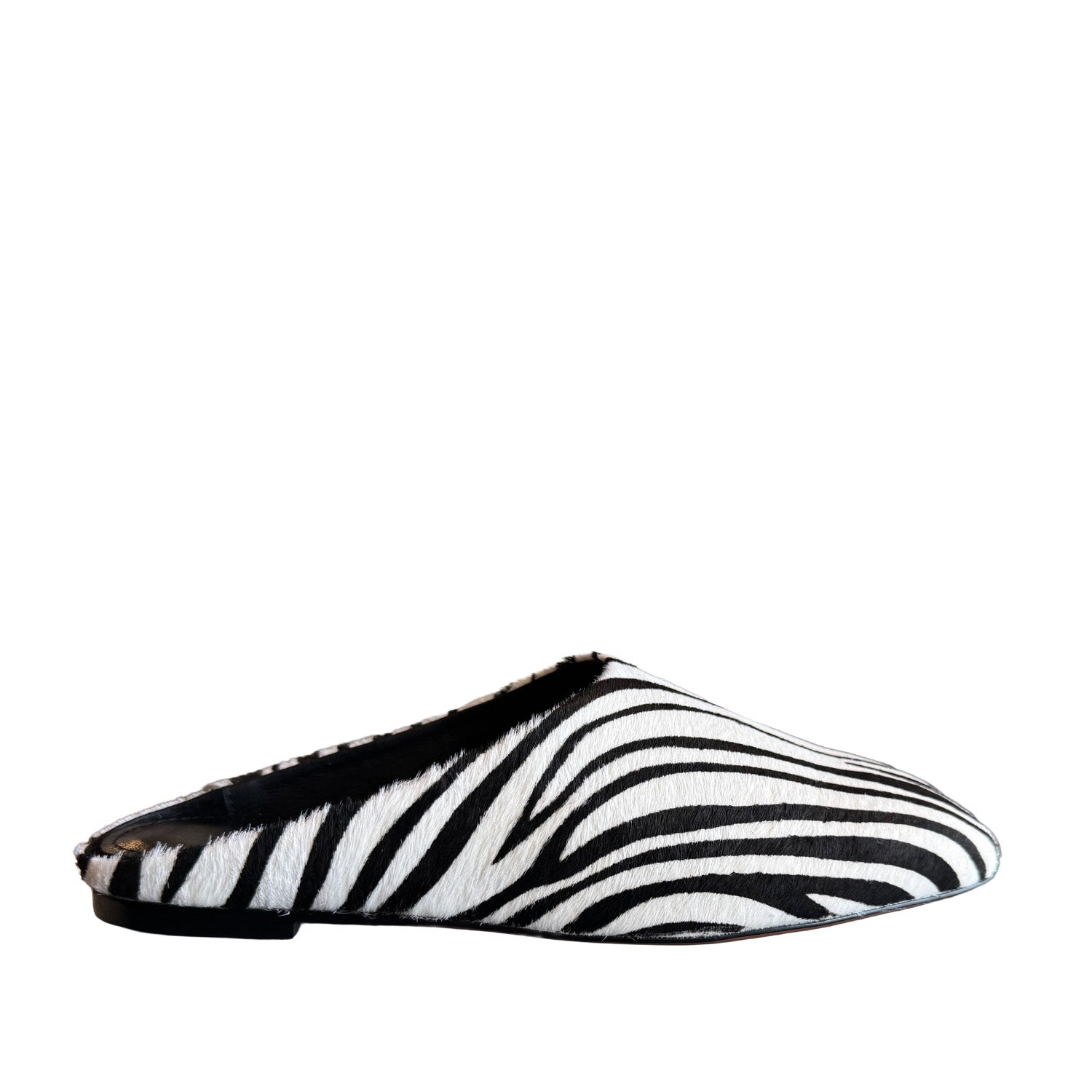 Black and white patterned slip on shoe on a white background
