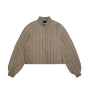 beige quilted bomber jacket on a white background