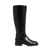 black leather riding boot on a white background