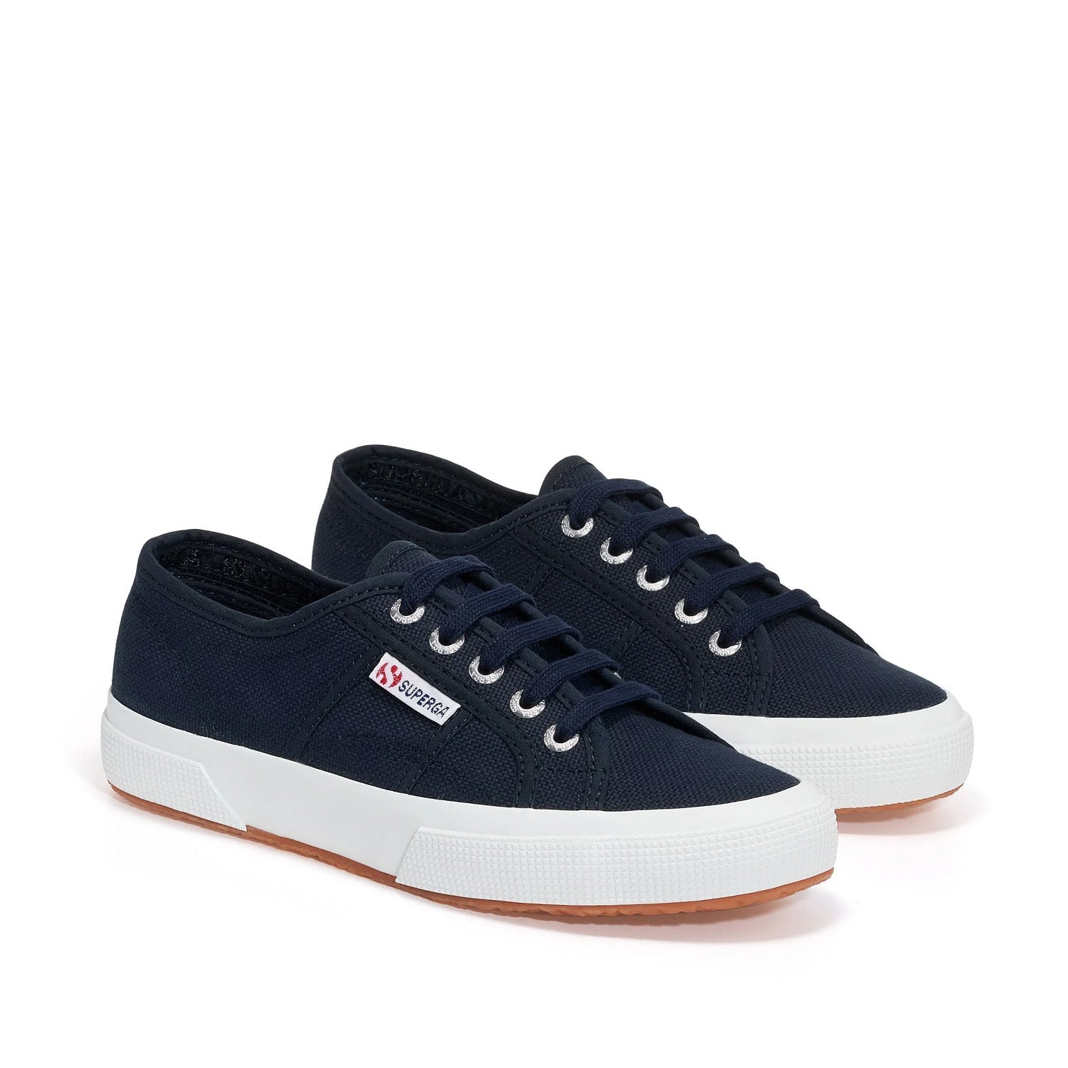 Navy lace-up sneaker with white sole on a white background