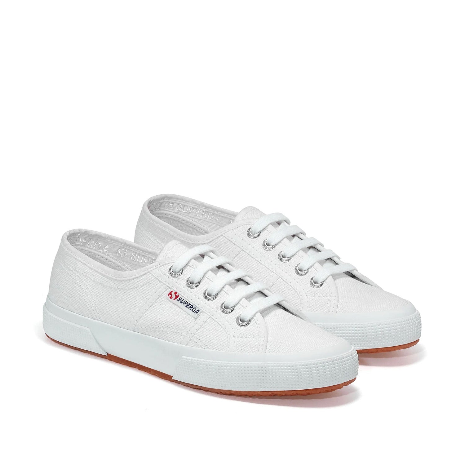 White lace-up canvas sneaker with white sole on white background