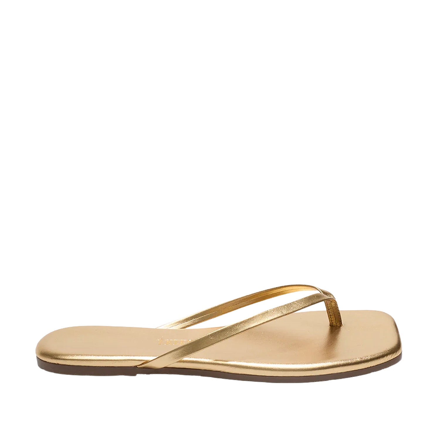 Gold metallic leather flip flops with a square toe on white background