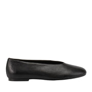 Black leather slip-on ballet flat on a white background