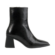 black patent leather heeled square-toe boot on a white background