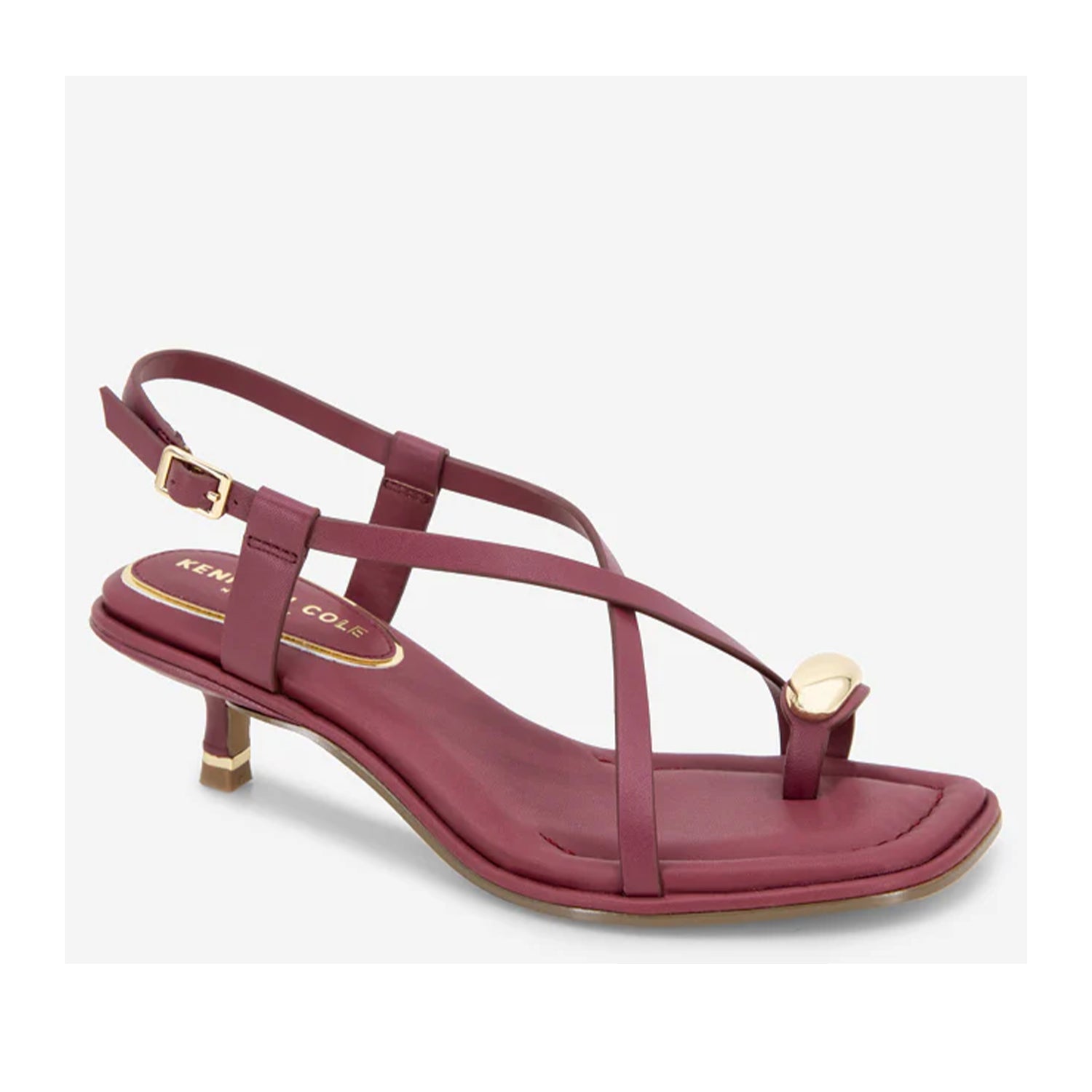 Red leather kitten heel sandal with slingback ankle strap, and hardware toe ring.