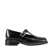 Black leather mary-jane loafers with a t-strap detail and adjustable buckle